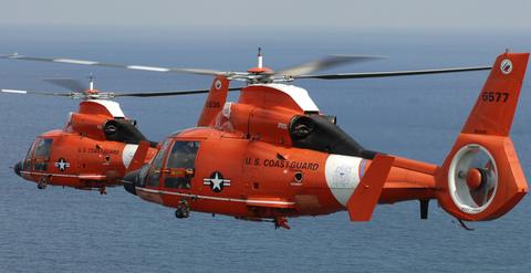 Two Coast Guard HH-65 Dolphin helicopters